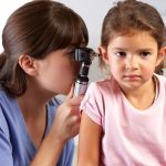 Doctor Examining Child’s Ears